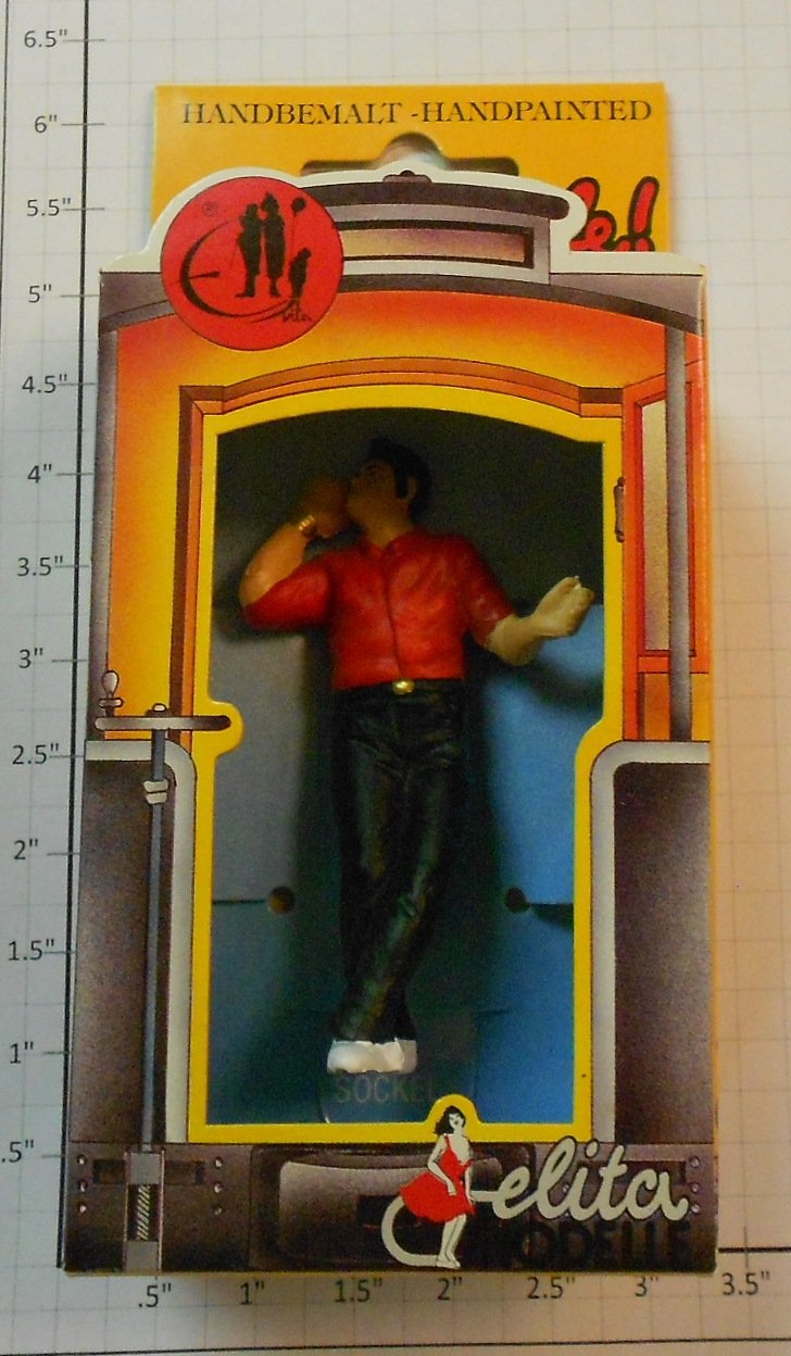 Elita Modelle 10063 Man with hand on his head and red shrit