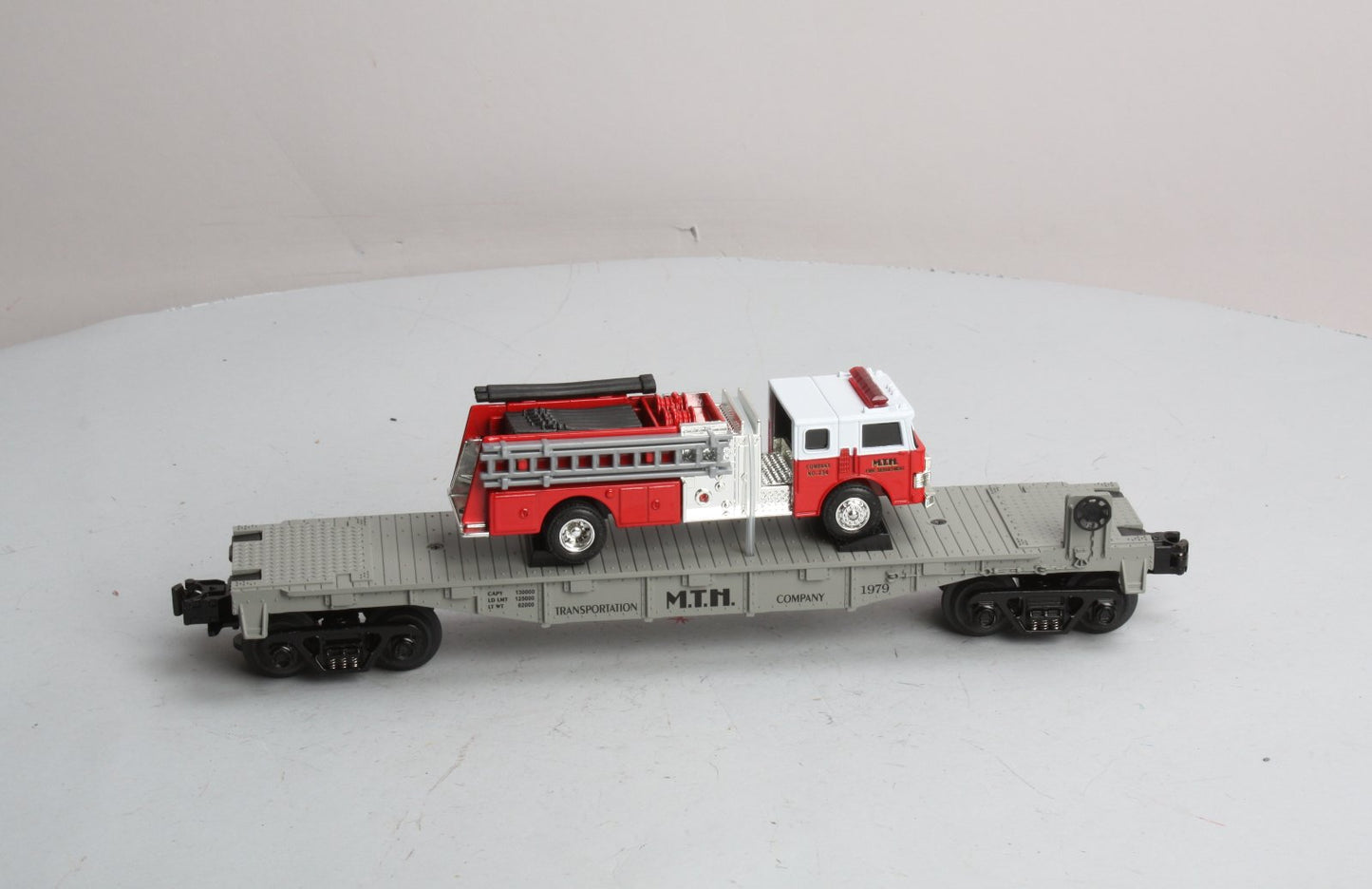 MTH 30-7629 O Gauge Transportation Company Flatcar with Ertl Fire Truck #1979 LN/Box