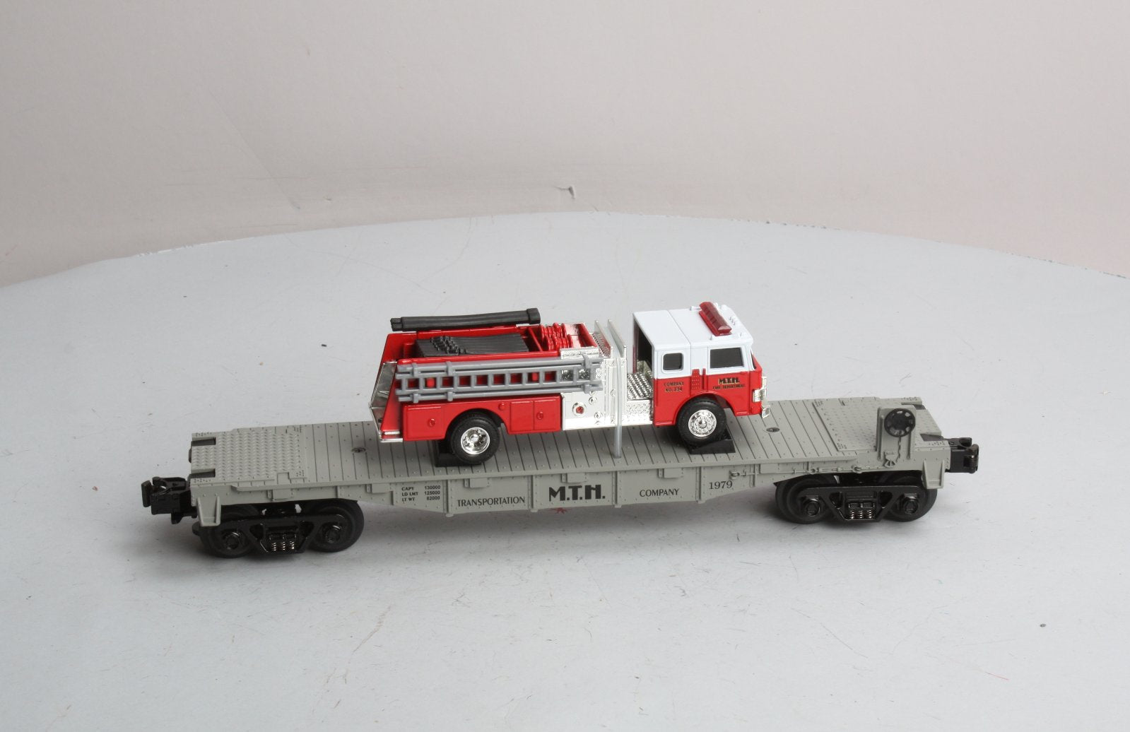 MTH 30-7629 O Gauge Transportation Company Flatcar with Ertl Fire Truck #1979 LN/Box