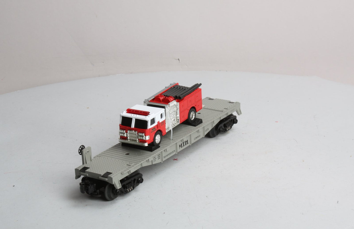 MTH 30-7629 O Gauge Transportation Company Flatcar with Ertl Fire Truck #1979 LN/Box