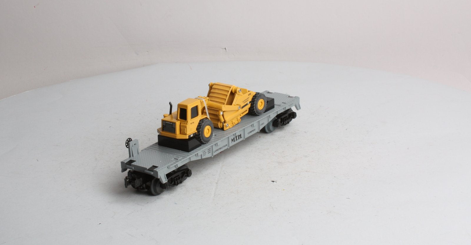 MTH 30-7616 O Gauge Construction Flatcar w/ Ertl Earth Mover #19981 LN/Box