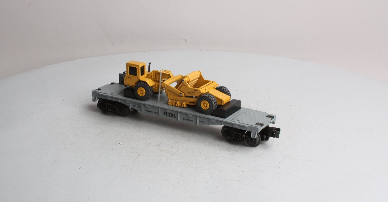 MTH 30-7616 O Gauge Construction Flatcar w/ Ertl Earth Mover #19981 LN/Box