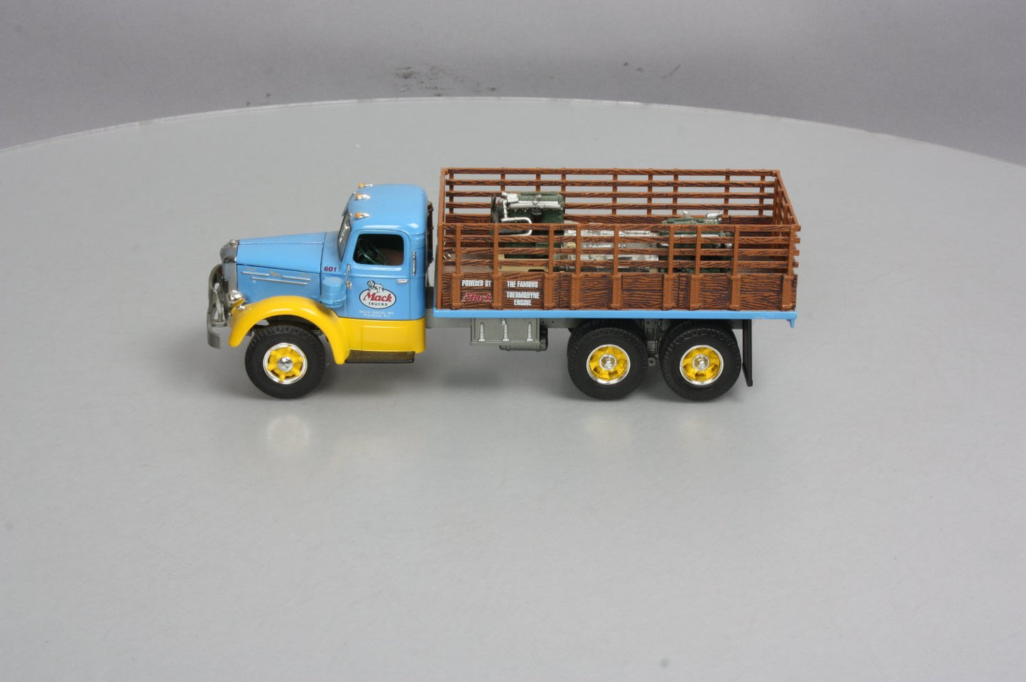 First Gear 19-3155 1:34 Mack L Series Stake Truck with Engine Load LN/Box