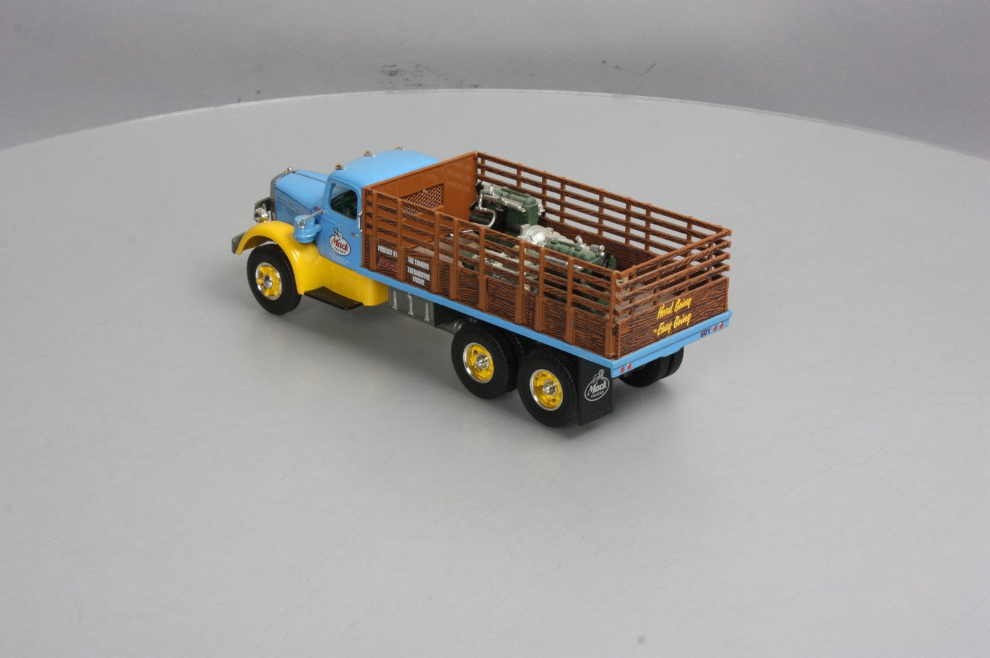 First Gear 19-3155 1:34 Mack L Series Stake Truck with Engine Load LN/Box