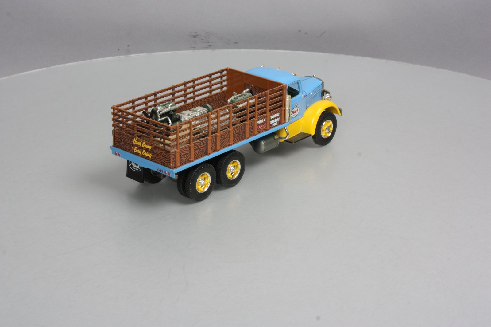 First Gear 19-3155 1:34 Mack L Series Stake Truck with Engine Load LN/Box