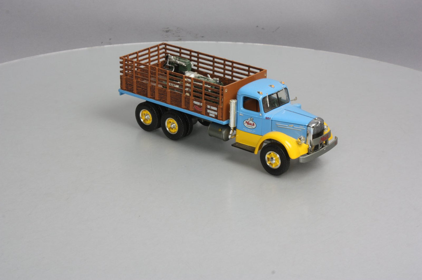 First Gear 19-3155 1:34 Mack L Series Stake Truck with Engine Load LN/Box