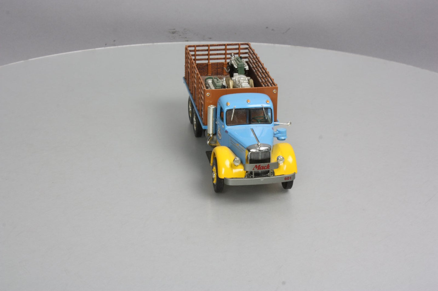 First Gear 19-3155 1:34 Mack L Series Stake Truck with Engine Load LN/Box