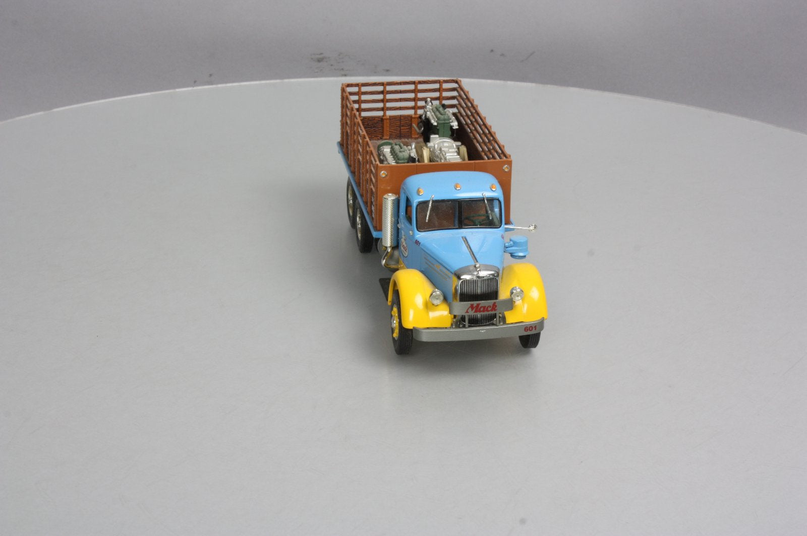 First Gear 19-3155 1:34 Mack L Series Stake Truck with Engine Load LN/Box
