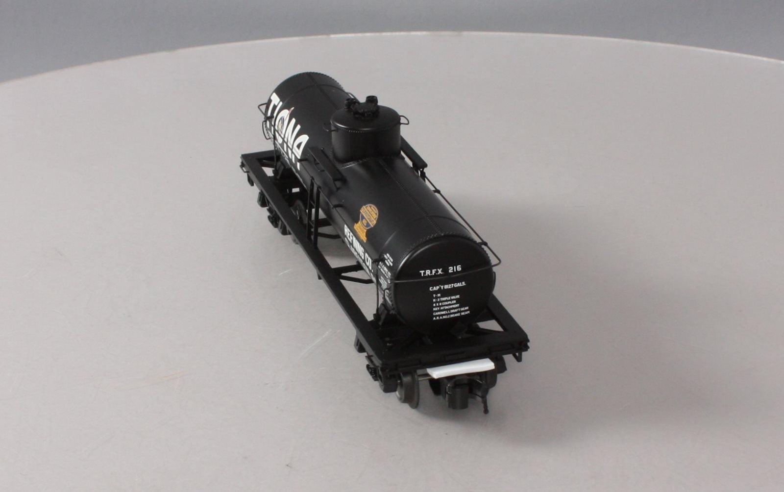 Atlas 3003828-1 O Gauge Tiona Refining Co. 8,000 Gallon Tank Car #216 (3-Rail) LN/Box