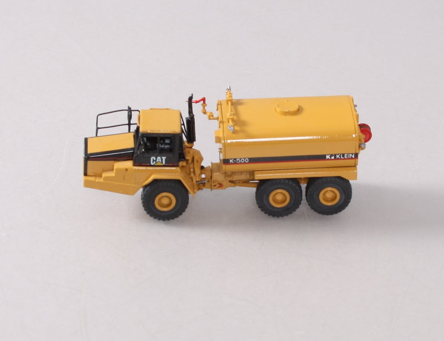 CCM BRASS 1:87 Scale Diecast CAT D250E II Articulated Truck LN/Box