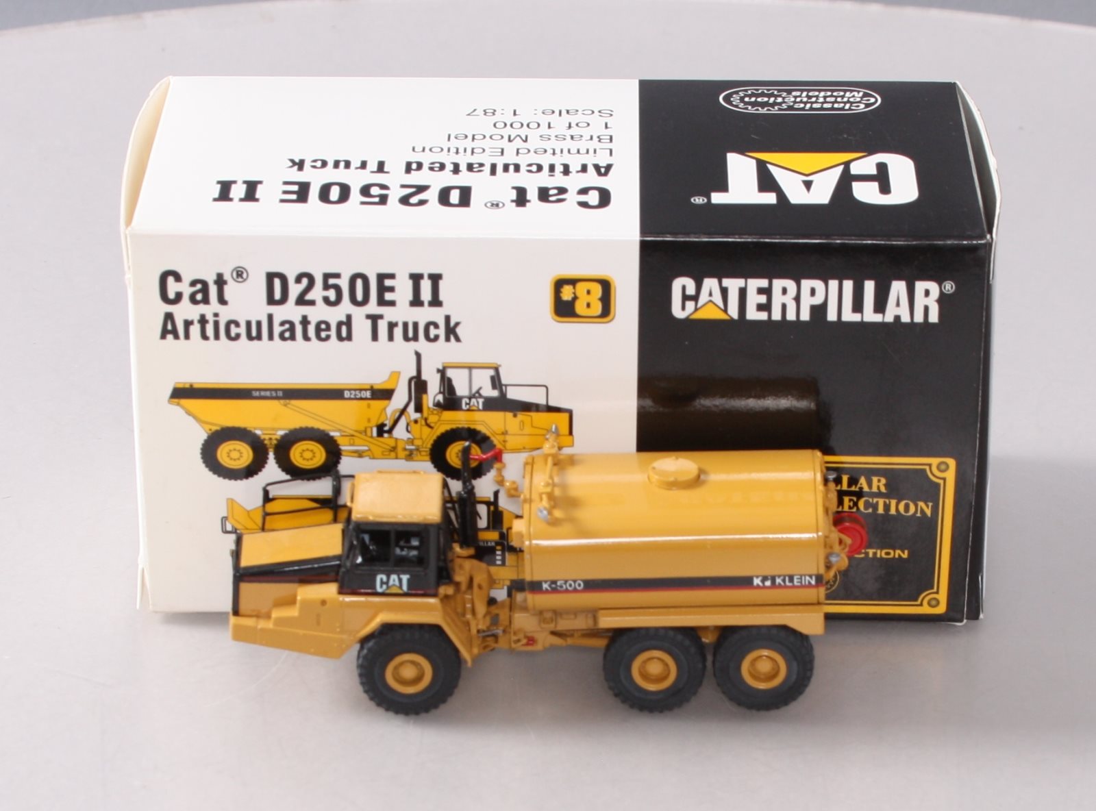 CCM BRASS 1:87 Scale Diecast CAT D250E II Articulated Truck LN/Box