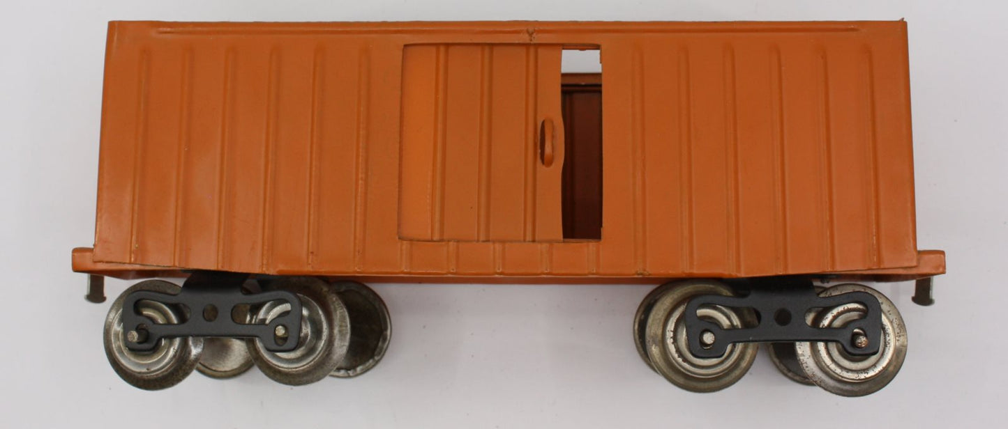 Lionel 114-1 Burnt Orange Freight Car with Door and Trucks-Incomplete