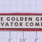 American Flyer FL0297 "The Golden Grain Elevator Co." Red & Black Border Sign