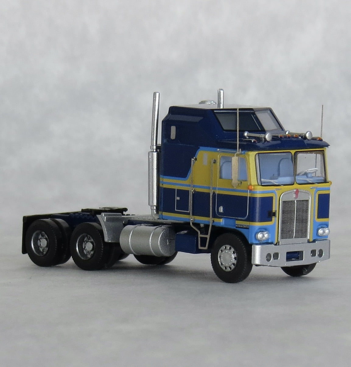 Trainworx Inc. 41066 N Potomac Blue & Yellow Kenworth K100 Aerodyne Tractor
