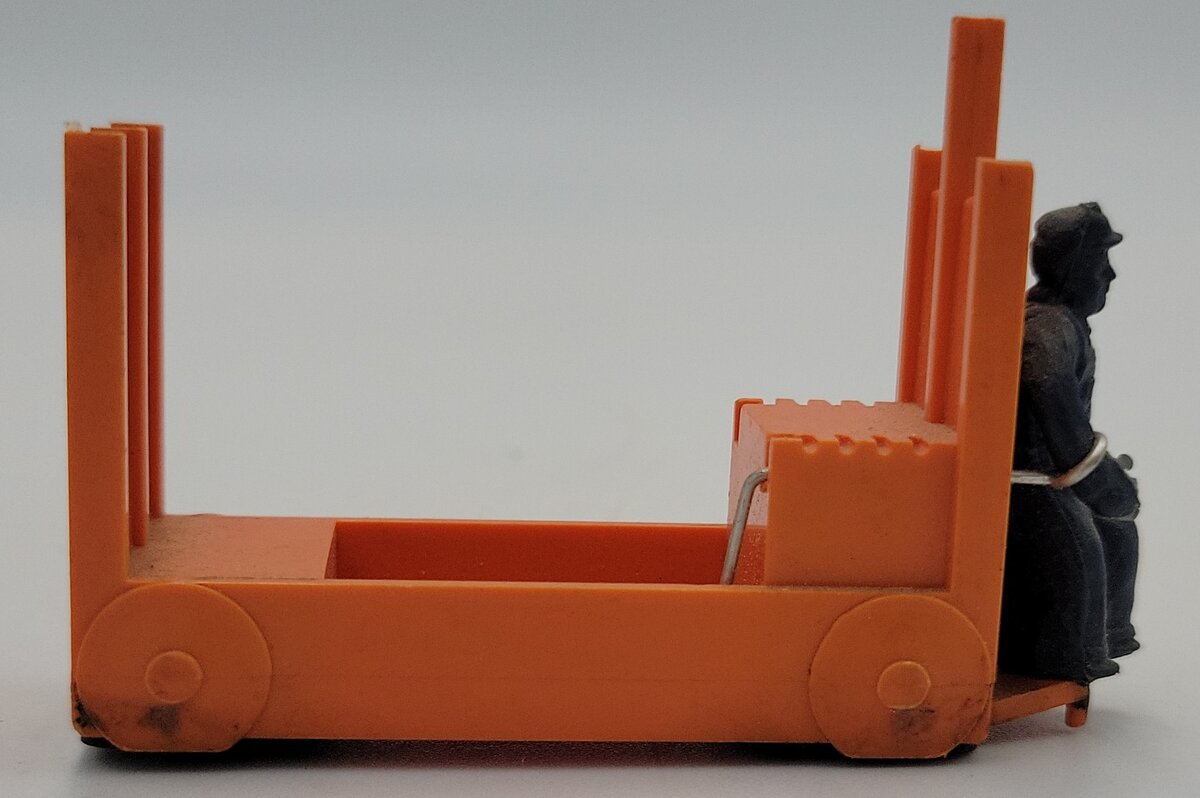Lionel 356-35 Light Orange Baggage Cart and Unpainted Figure