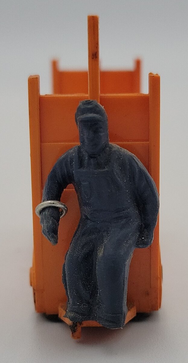 Lionel 356-35 Light Orange Baggage Cart and Unpainted Figure