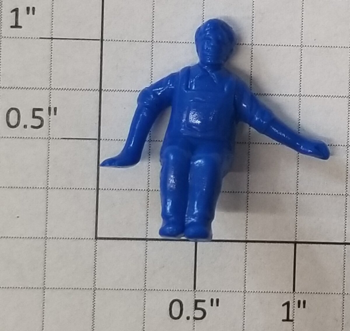 Lionel 50-76 Blue Sitting Man Figure with Left Arm Out and Right Arm Down