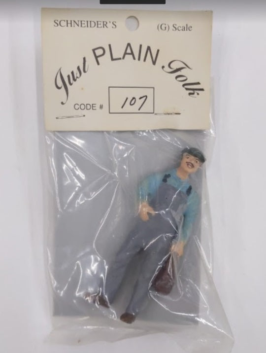 Just Plain Folk 107 Worker in Overalls Holding Bag