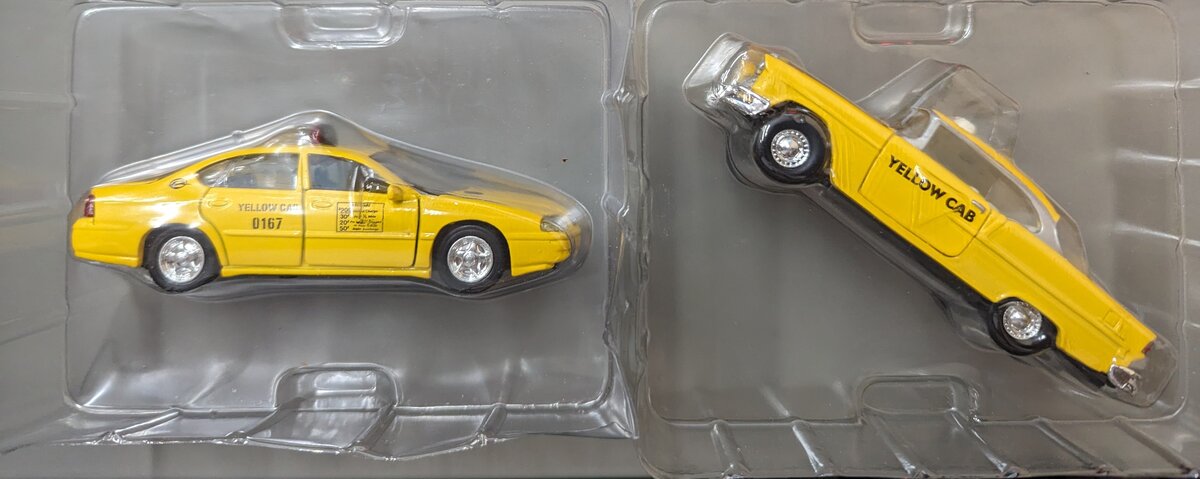 Matchbox RC1035 1:43 Die-Cast Yellow Modern Taxi Cab and Yellow Vintage Taxi Cab