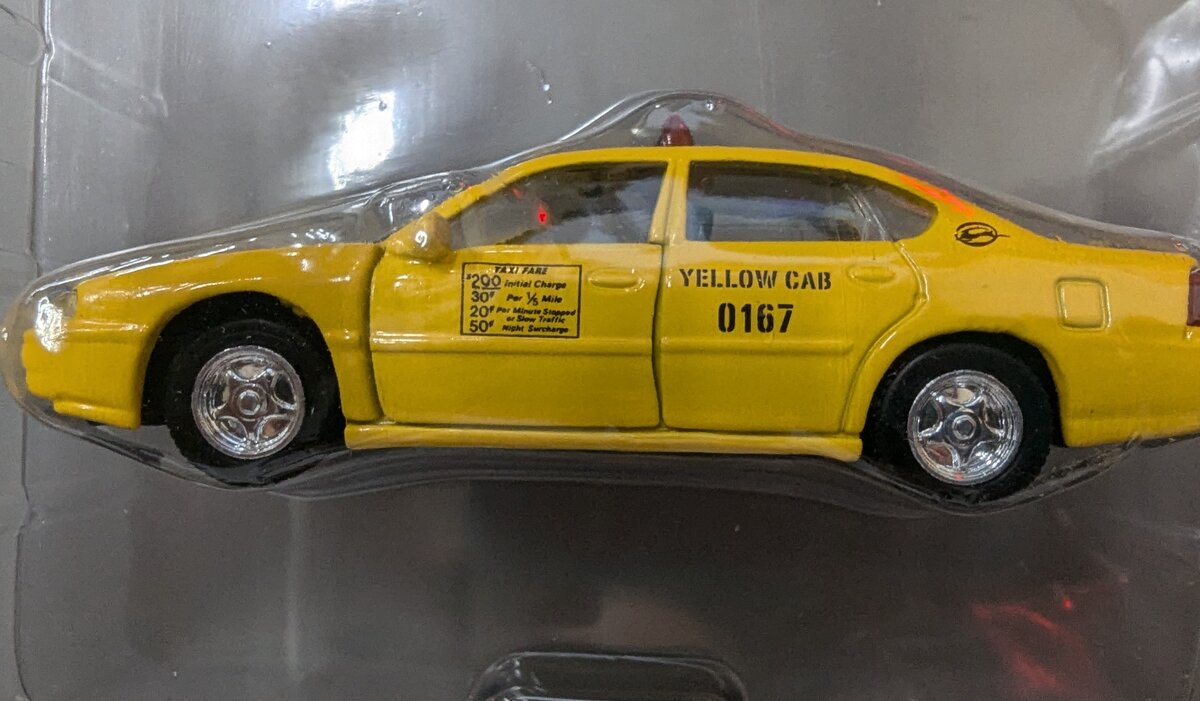 Acme L599 1:64 Diecast Yellow Cab Taxi Set of 2