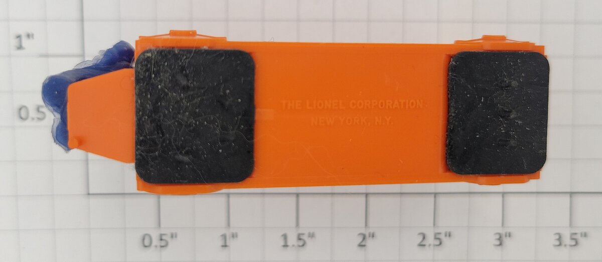 Lionel 356-34 Orange Baggage Cart with Unpainted Figure