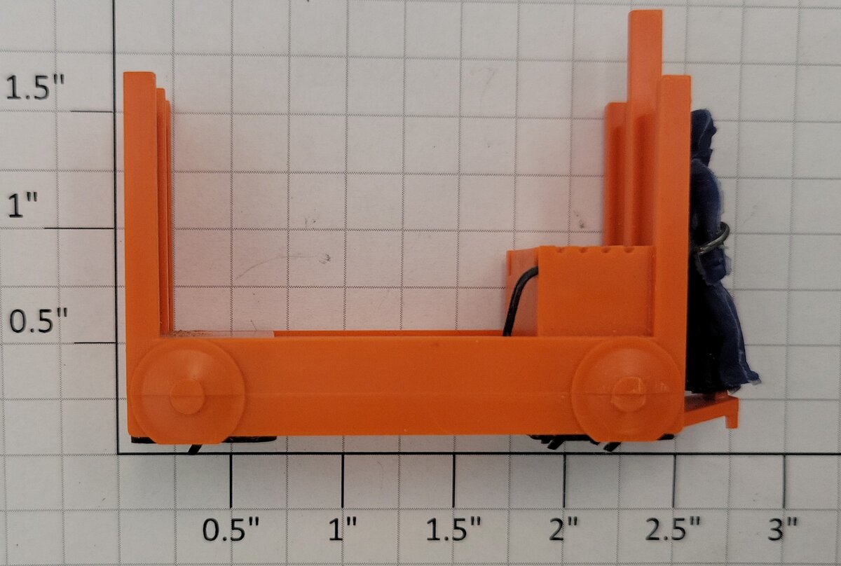 Lionel 356-34 Orange Baggage Cart with Unpainted Figure