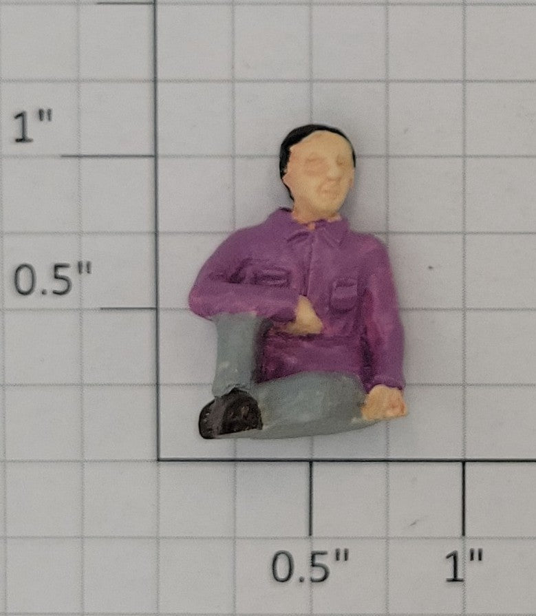 Acme 0827-21 O Gauge Male Sitting in Purple Shirt and Gray Pants