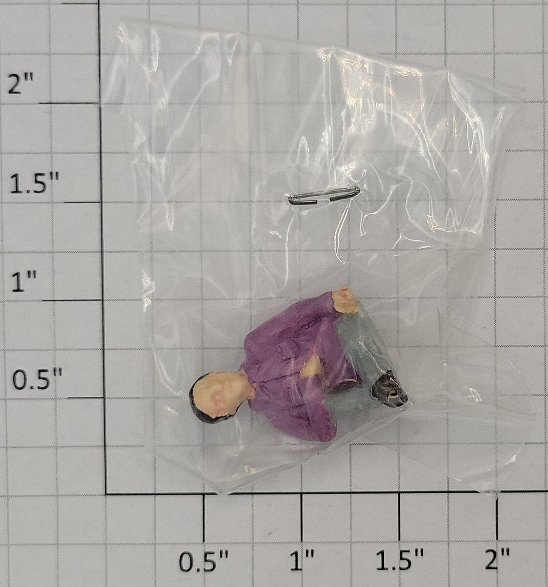 Acme 0827-21 O Gauge Male Sitting in Purple Shirt and Gray Pants