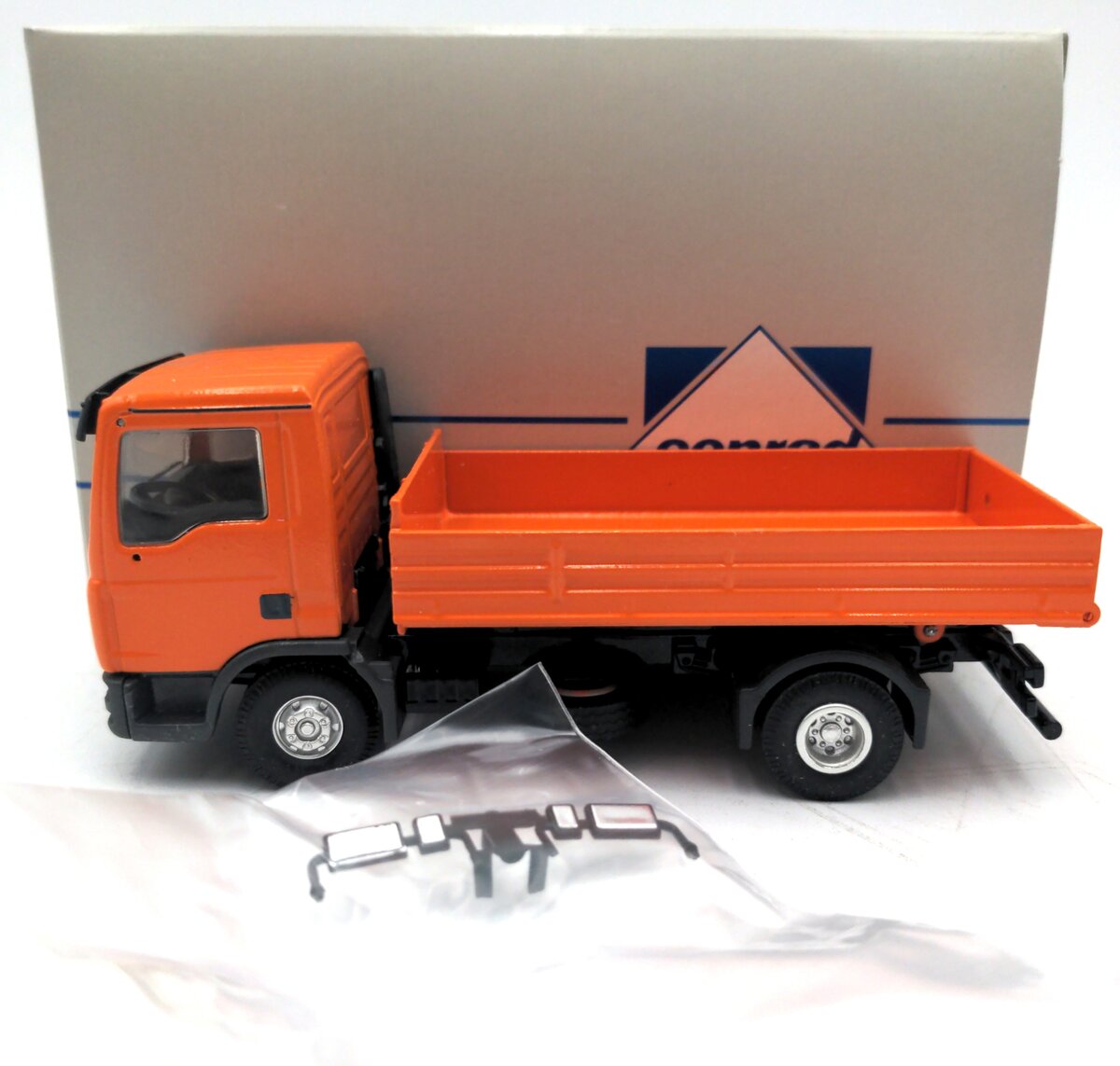 Conrad 67102 1:50 MAN TG-L w/Low Side Dump Body