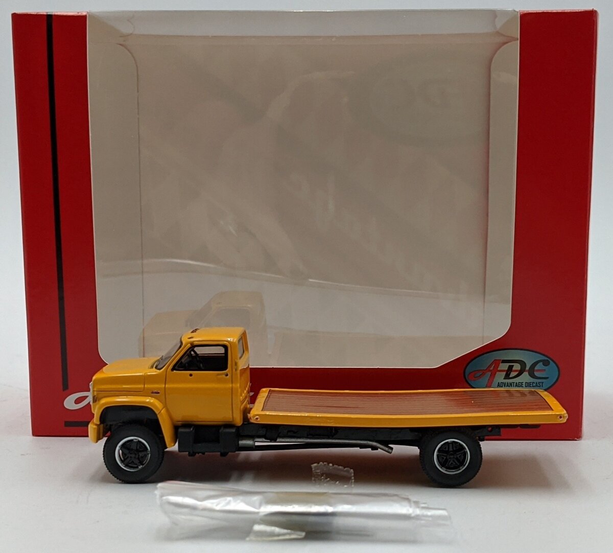 ADC ADC30103 1:64 Chevrolet C-65 Flatbed Truck 1975 Yellow