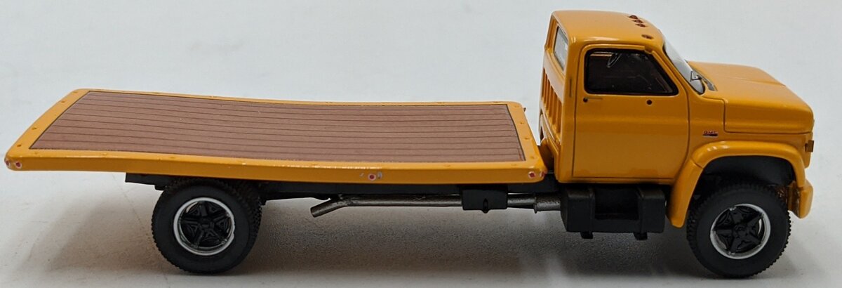 ADC ADC30103 1:64 Chevrolet C-65 Flatbed Truck 1975 Yellow
