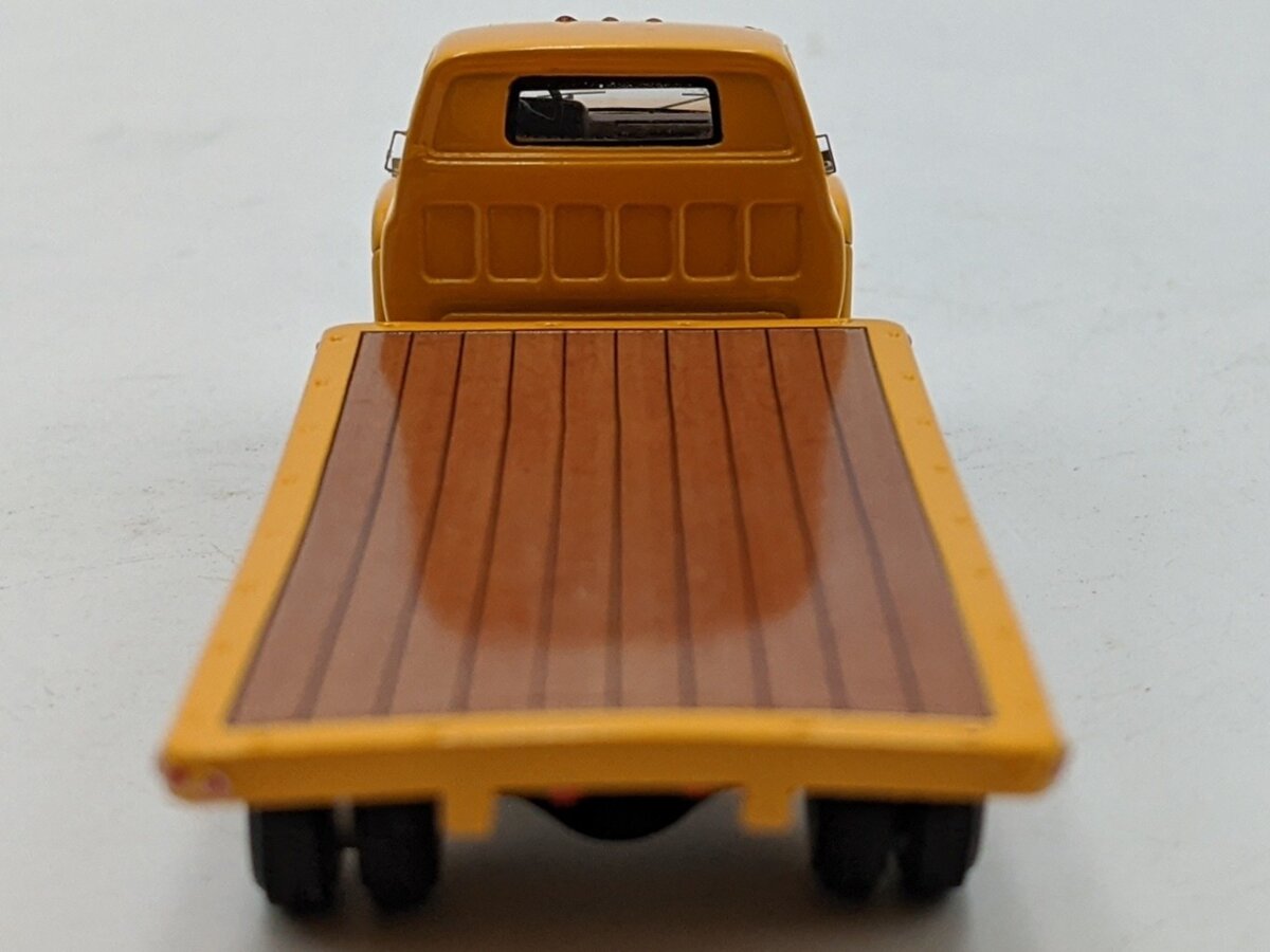 ADC ADC30103 1:64 Chevrolet C-65 Flatbed Truck 1975 Yellow