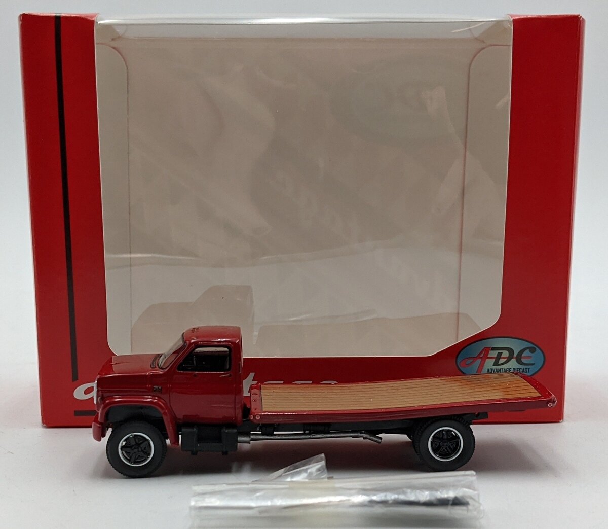 ADC ADC30100 1:64 Chevrolet C-65 Flatbed Truck 1975 Red