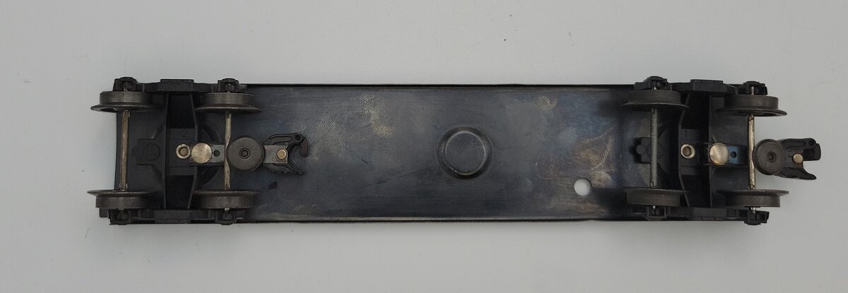 Lionel 6352-11 Boxcar Frame with Two Holes, Trucks and Operating Couplers