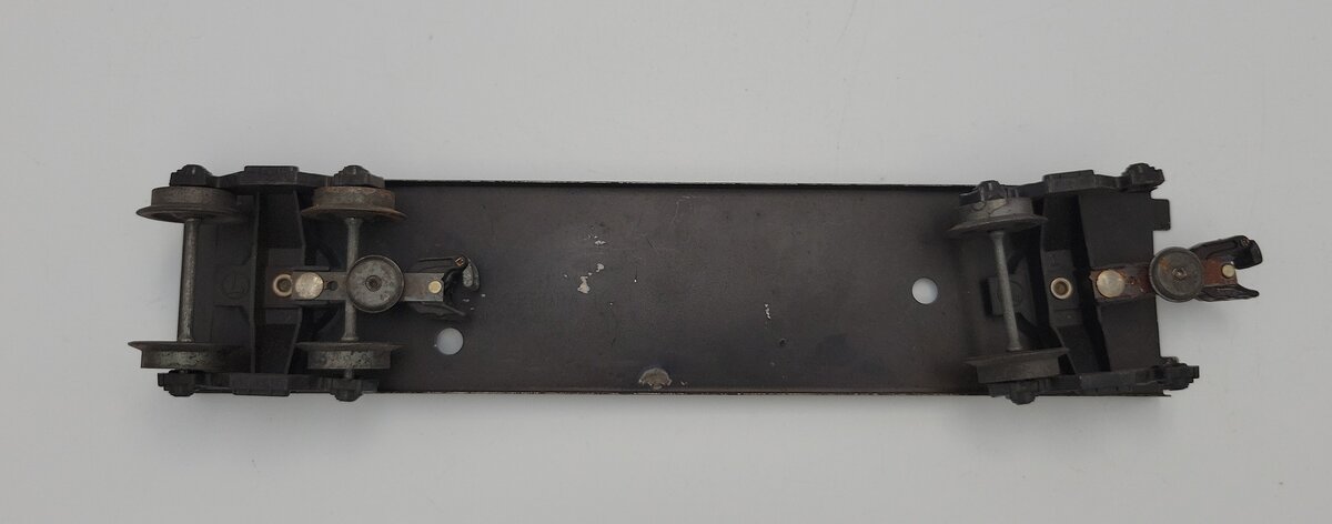 Lionel 6464-9 O Gauge Two Hole Boxcar Frame with Trucks and Operating Couplers