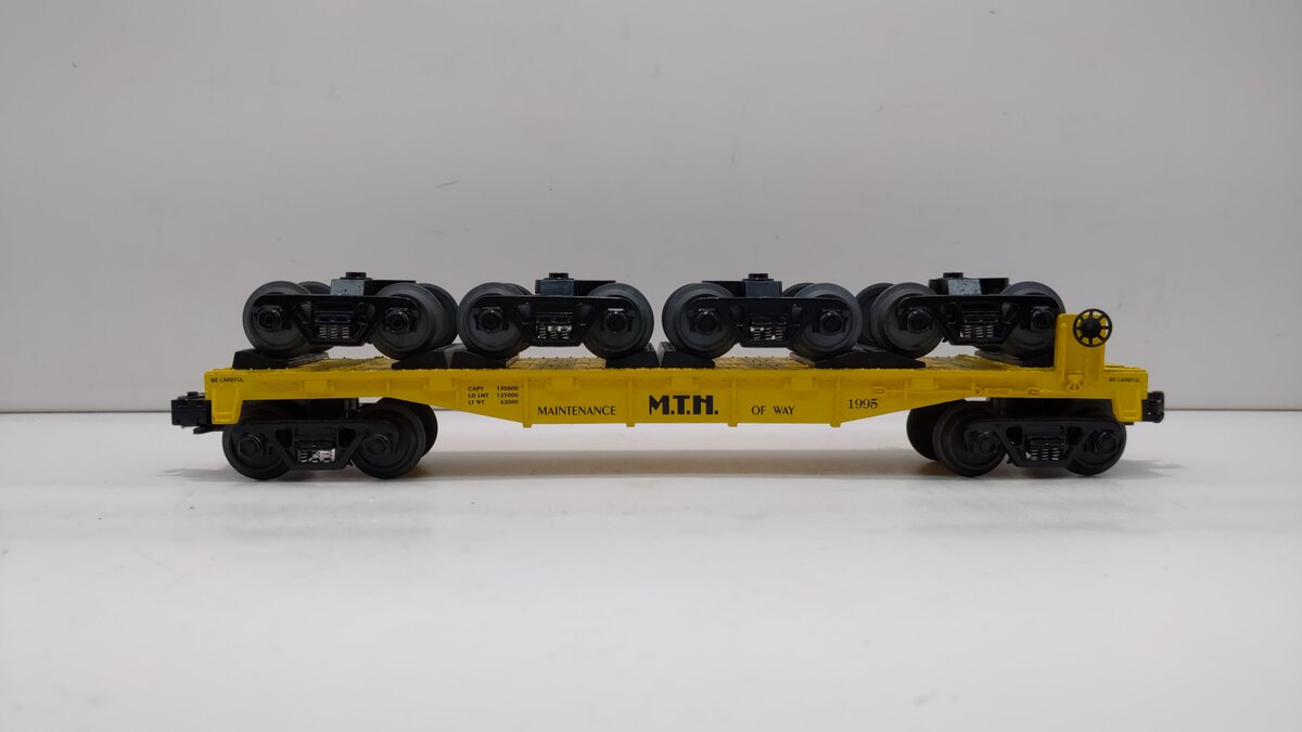 MTH 30-7669 O Gauge Transport Flatcar w/ 4 Freight Trucks #1995 LN/Box