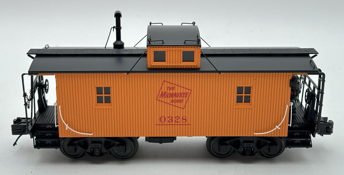 MTH 20-91582 O Milwaukee Road N-6b Caboose with Operating Signal Man #0328