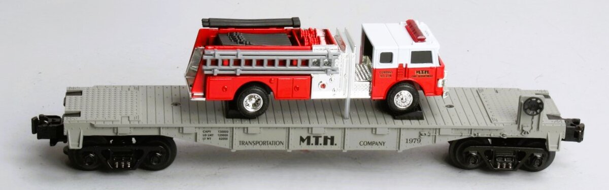 MTH 30-7629 O Gauge Transportation Company Flatcar with Ertl Fire Truck #1979 NIB