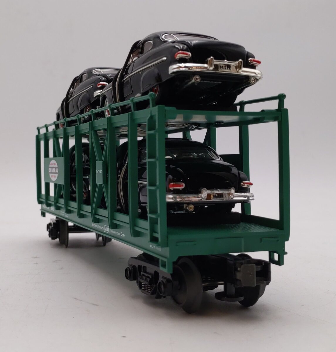 MTH 30-7682 O Gauge New York Central Auto Carrier #325 with 4 Ertl 1949 Mercurys NIB