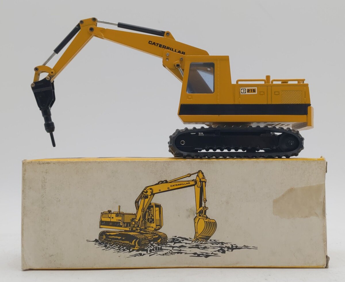 NZG 190 1:50 Caterpillar 215 Hydraulic Excavator with Hammer EX/Box