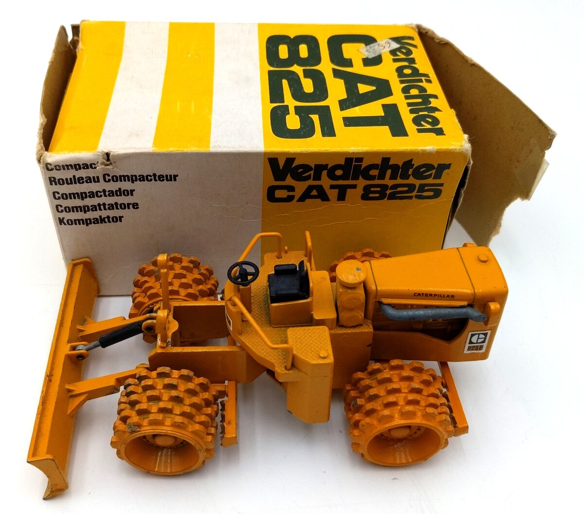 NZG 135 1:50 Scale Diecast Caterpillar 825 Compactor - Yellow VG/Box