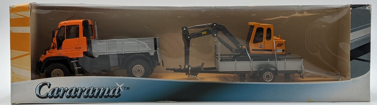 Cararama 482 1:43 Mercedes-Benz Unimog U300 Towing Trailer With Mini Excavator NIB