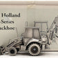 SpecCast DS-9673605 1:50 Pewter New Holland E-Series Backhoe 555E LN/Box