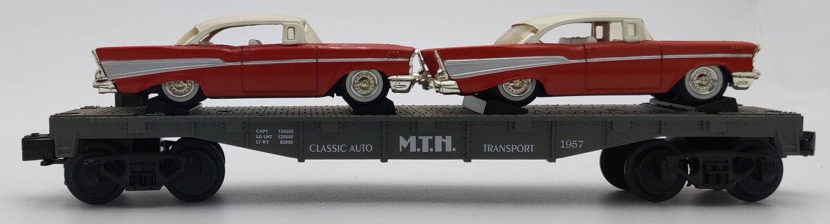 MTH 30-7610 O Gauge MTH Lines Flat Car with 2 Red Ertl '57 Chevys VG/Box