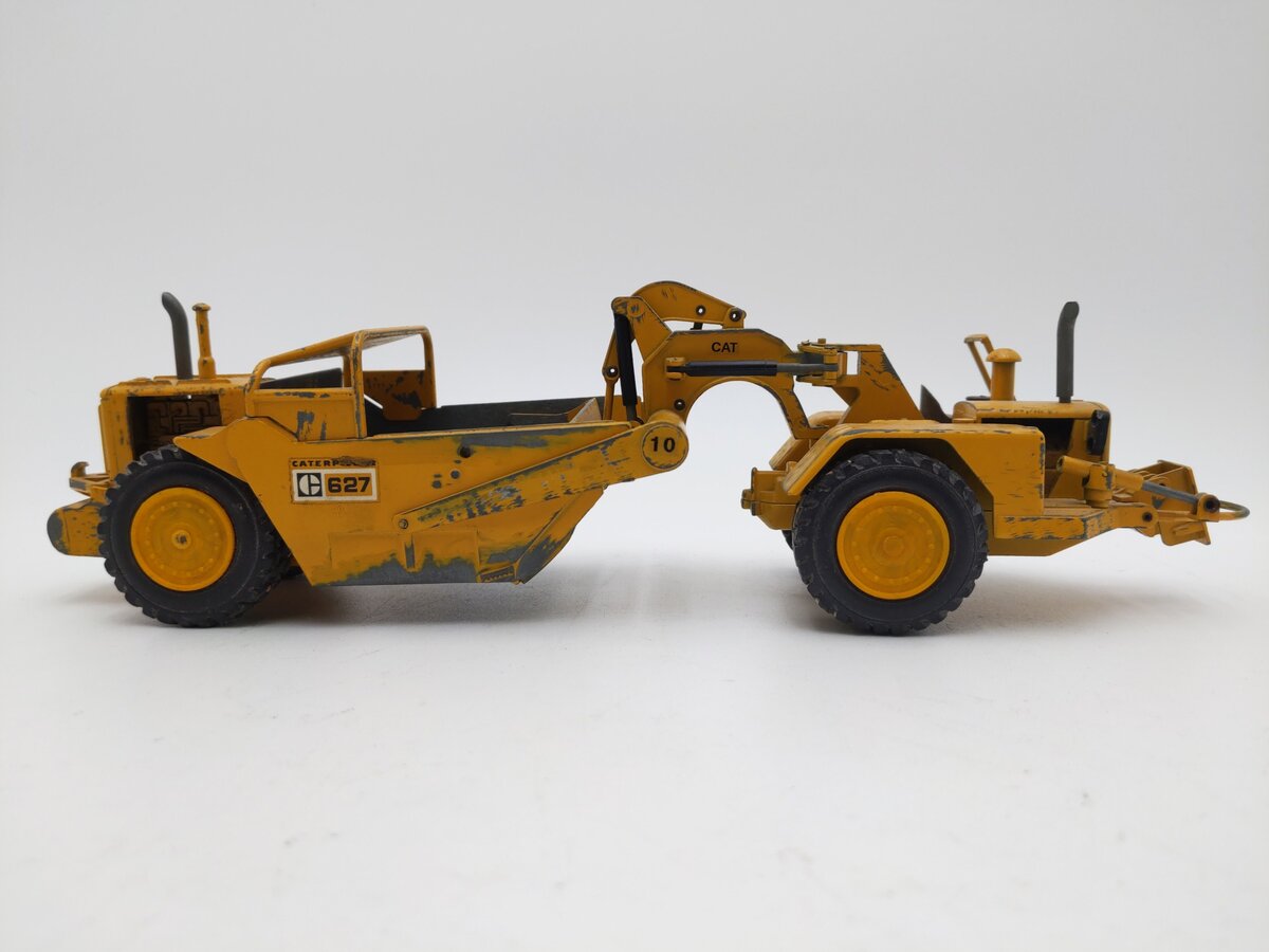 NZG 127 1:50 Scale Diecast Caterpillar 627 Push-Pull Scraper - Weathered EX