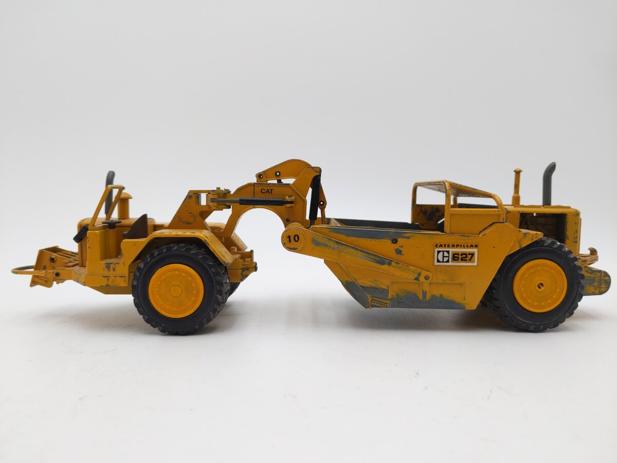 NZG 127 1:50 Scale Diecast Caterpillar 627 Push-Pull Scraper - Weathered EX