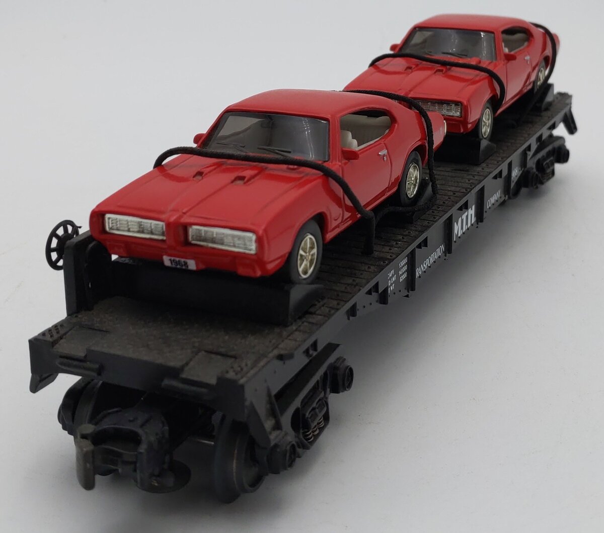 MTH 30-7639 O Gauge MTH Auto Transportation Flatcar with 2 Ertl '68 GTOs #1968 LN/Box