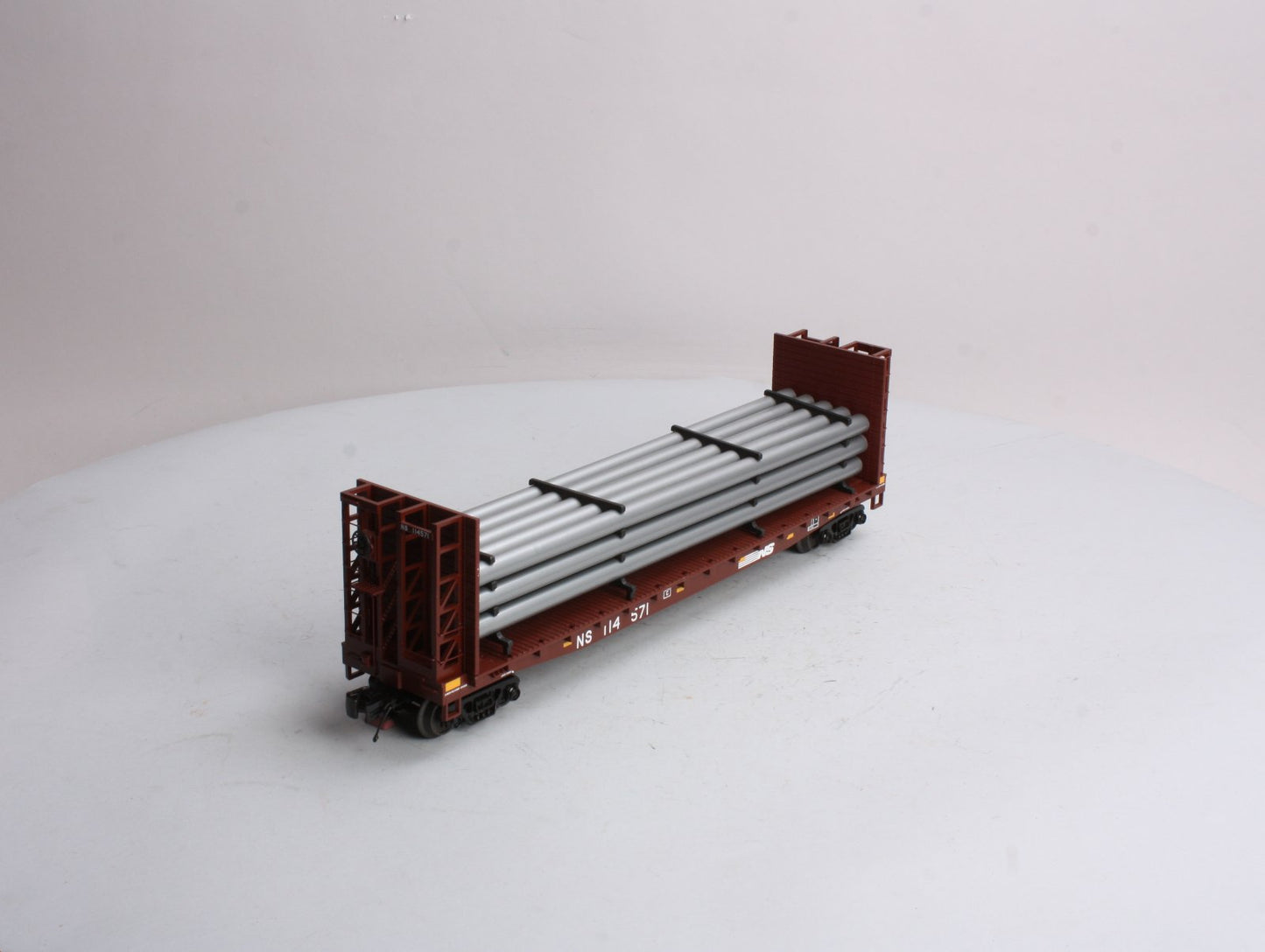 MTH 20-98666 Norfolk Southern Flat Car - w/Bulkheads & Pipe Load