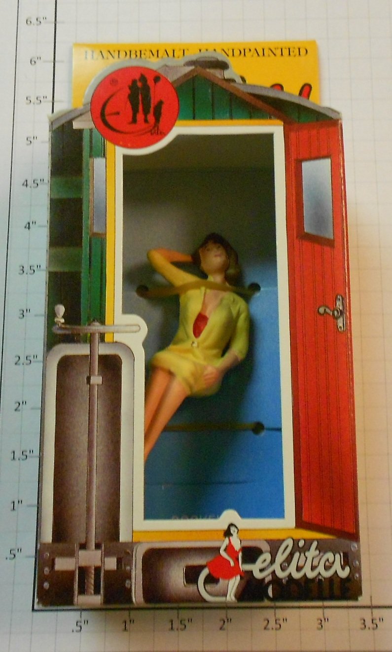 Elita Modelle 10034 Siting girl with tan dress figure