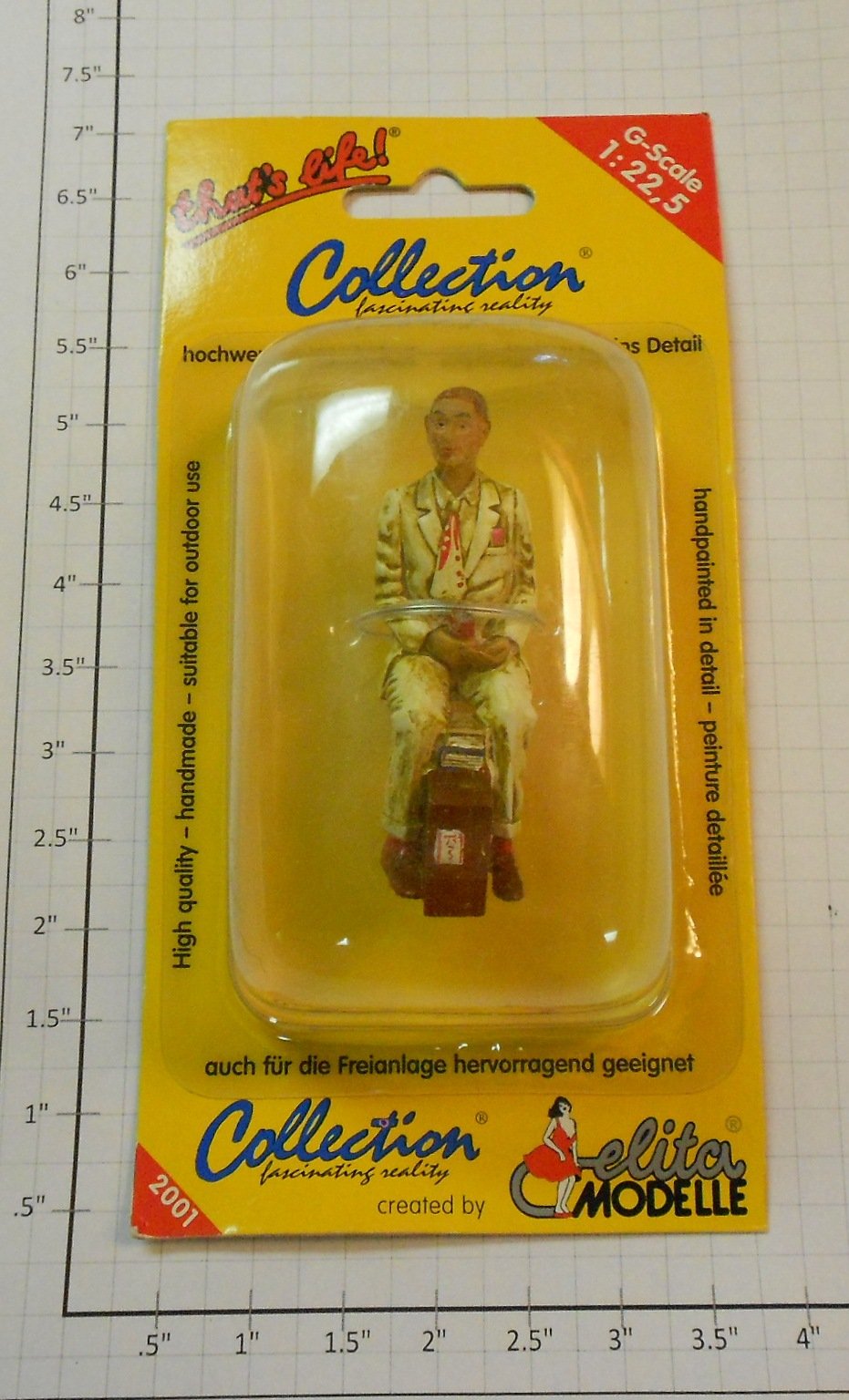 Elita Modelle 10115 Man siting tan suit with luggage figure